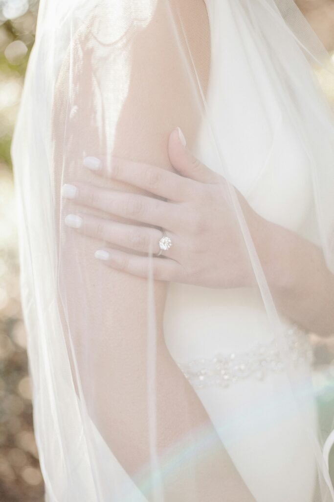 Close-up of a bride bathed in sunlight during a seaside wedding in Barcelona — perfect for Swiss couples dreaming of a Mediterranean celebration on the Costa Brava